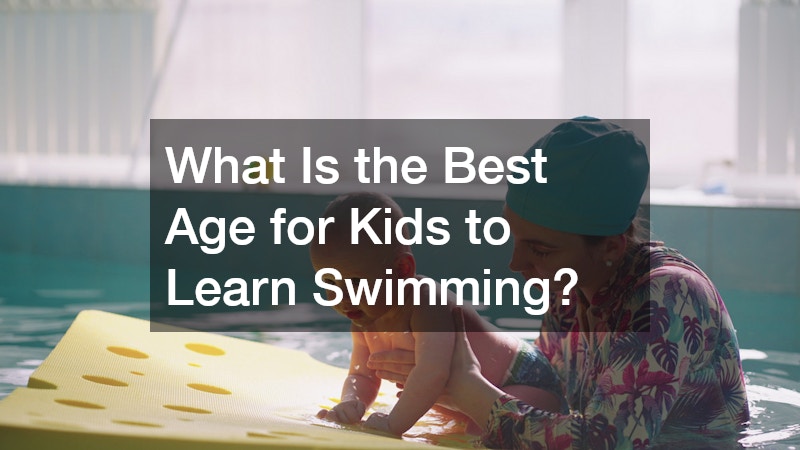 an instructor teaching an infant how to swim
